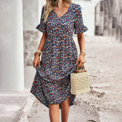 Lena – legende sommerkjole i abrikos med blomsterprint