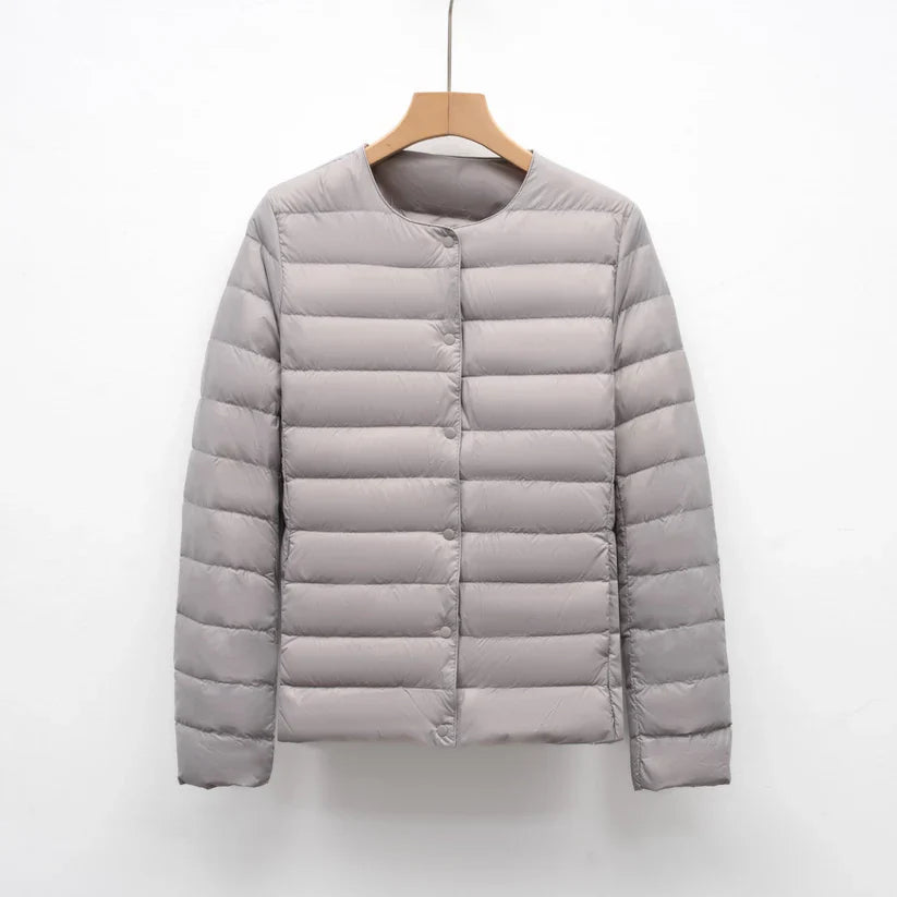 Freja – lightweight fitted down jacket with snap closure